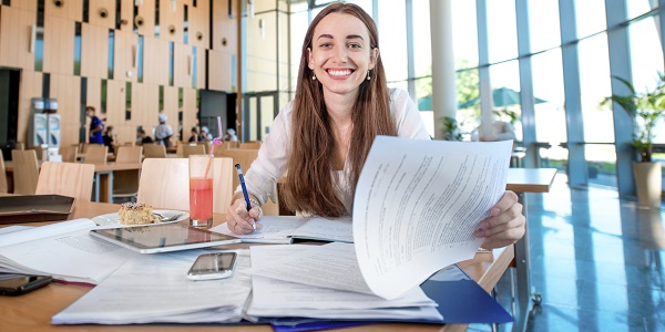girl studying in university canteen girl studying in university canteen