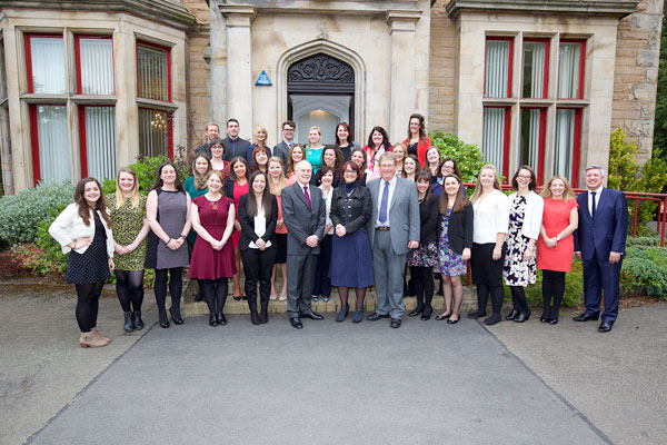 education graduates pose for a group photograph with Angela Constance
