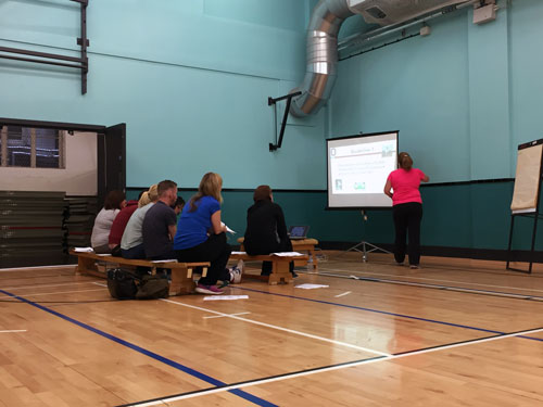 Strathclyde researchers sit and watch a presentation