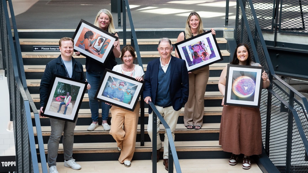image of 5 winners holding framed pictures