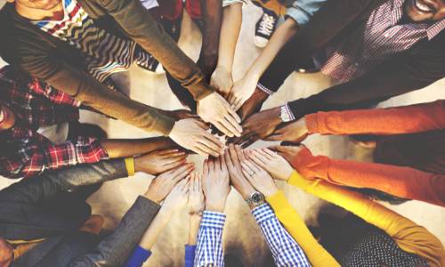 Diverse range of hands in a circle