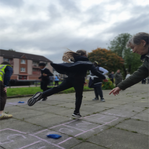photograph of a chuild playing hopscotch photograph of a chuild playing hopscotch