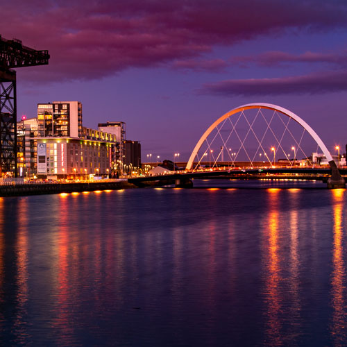 the clyde crane and squinty bridge on the river clyde at dusk the clyde crane and squinty bridge on the river clyde at dusk