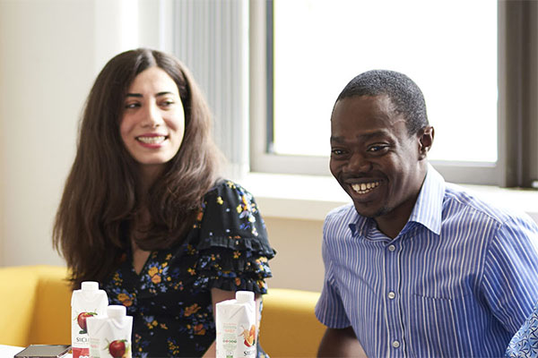 Two students smiling on campus