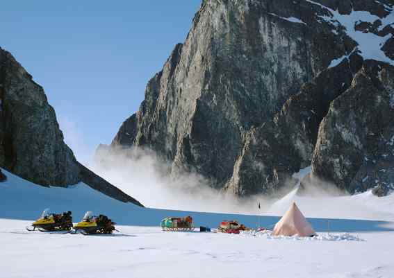 This image shows a snowy survey camp among Antarctic mountains This image shows a snowy survey camp among Antarctic mountains